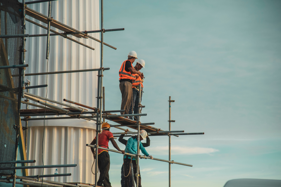 Construction workers working on a high-rise building.